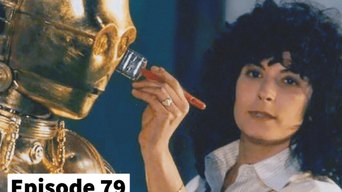 A young Miki Herman, with dark, permed hair using a paintbrush to touch up the C3PO mask