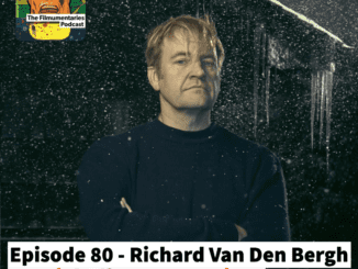 Richard Van Den Bergh stood in the dark, a light on his face, rain or snow is falling all around.